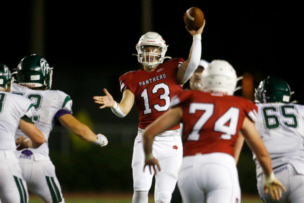 Snohomish’s Kale Hammer jumps to make a screen pass against Edmonds-Woodway on Friday, Sep. 23, 2022, at Snohomish High School in Snohomish, Washington. (Ryan Berry / The Herald)
