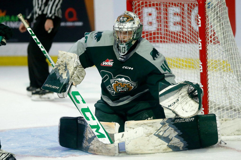 Everett Silvertips goalie Braden Holt goes down into the butterfly while playing during the season opener against the Vancouver Giants on Saturday, Sep. 24, 2022, at Angel of the Winds Arena in Everett, Washington. (Ryan Berry / The Herald)