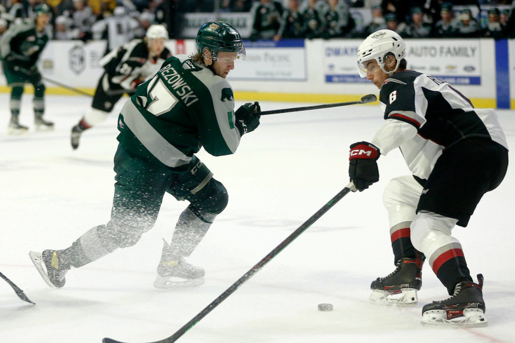 Everett Silvertips’ Jackson Berezowski tries to deke a defender during the season opener against the Vancouver Giants on Saturday, Sep. 24, 2022, at Angel of the Winds Arena in Everett, Washington. (Ryan Berry / The Herald)