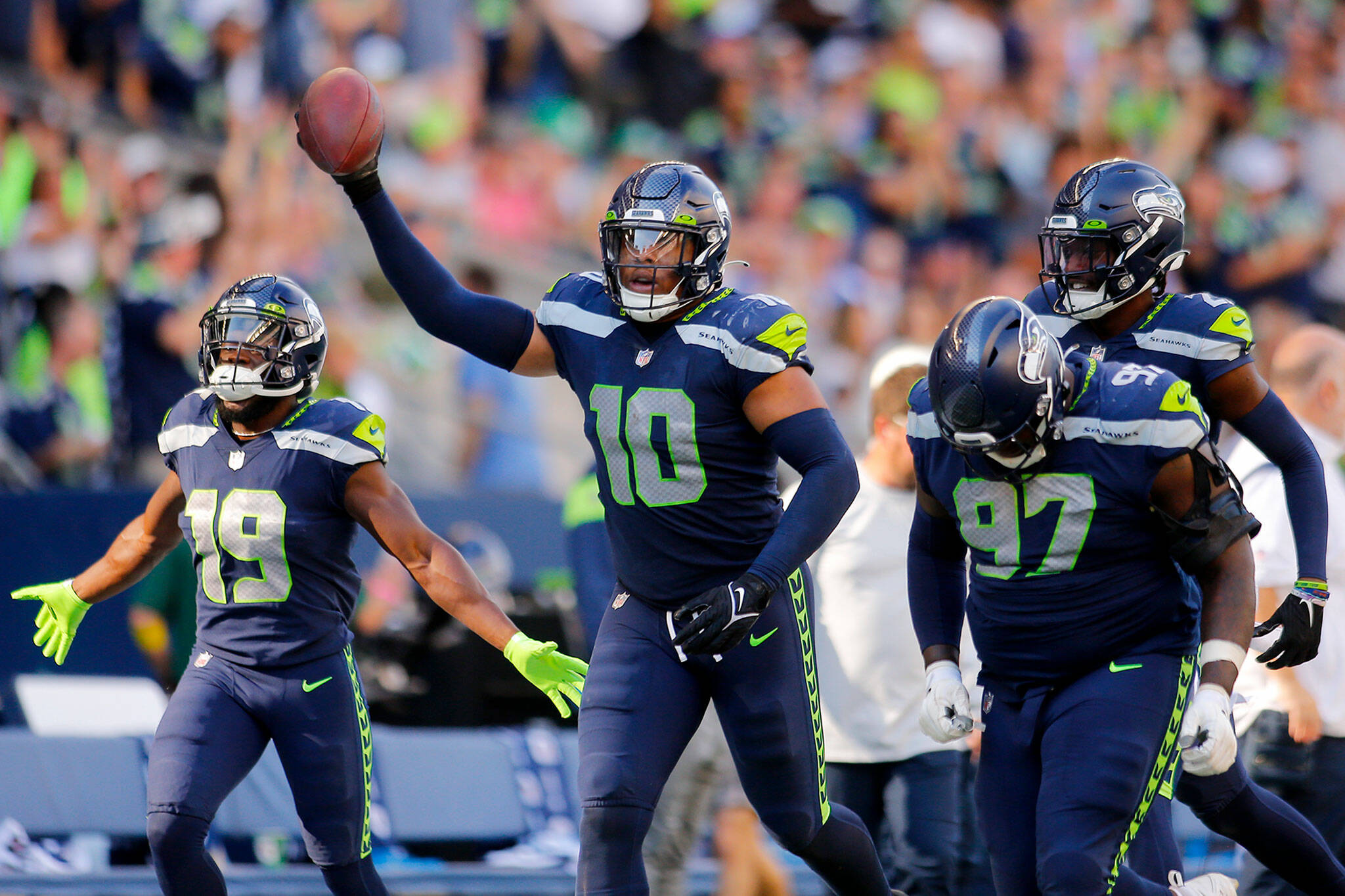 The Seattle Seahawks’ Uchenna Nwosu celebrates a fourth quarter fumble recovery against the Atlanta Falcons on Sunday, Sep. 25, 2022, at Lumen Field in Seattle, Washington. (Ryan Berry / The Herald)