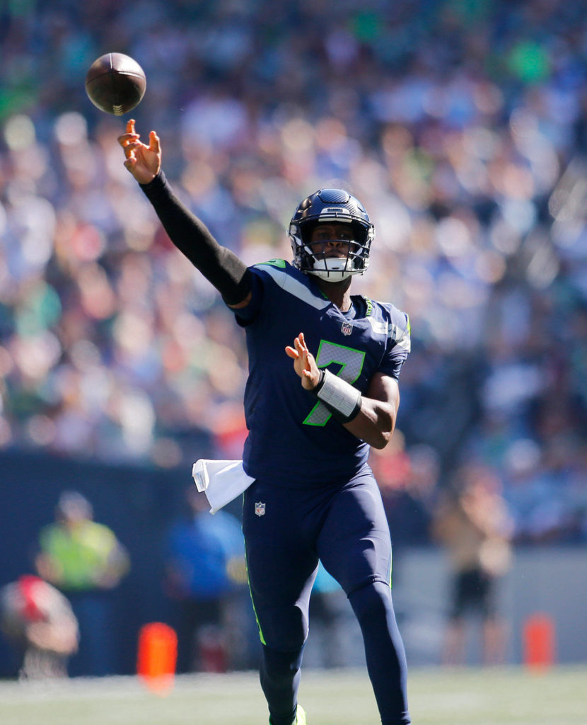 The Seattle Seahawks’ Geno Smith connects with DK Metcalf for a touchdown throw in the first half against the Atlanta Falcons on Sunday, Sep. 25, 2022, at Lumen Field in Seattle, Washington. (Ryan Berry / The Herald)
