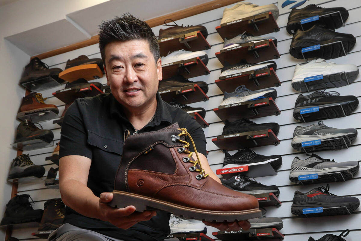 At two stores – in Edmonds and Renton – Wide Shoes Only store owner Dominic Ahn offers more than 600 styles of shoes for people with wide feet. (Kevin Clark / The Herald)