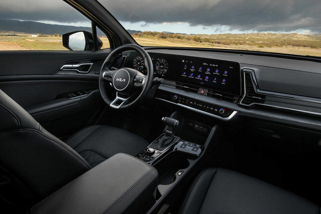 A curved panoramic 12.3-inch display is a prominent feature of the 2023 Kia Sportage interior. (Kia)
