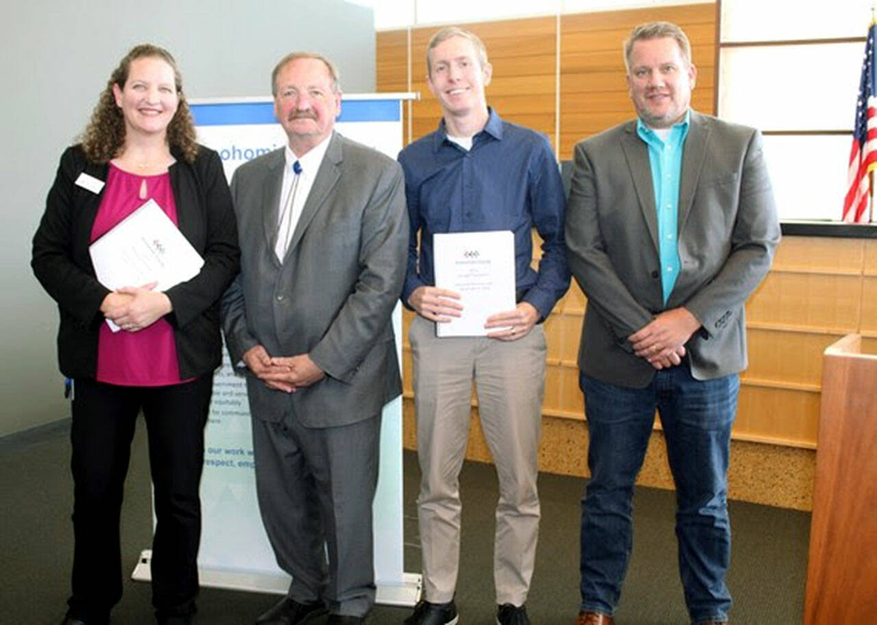 Councilmember Megan Dunn, left, stands next to County Executive Dave Somers as he presents his 2023 budget proposal to her, Councilmember Nate Nehring and Councilmember Sam Low (Snohomish County)