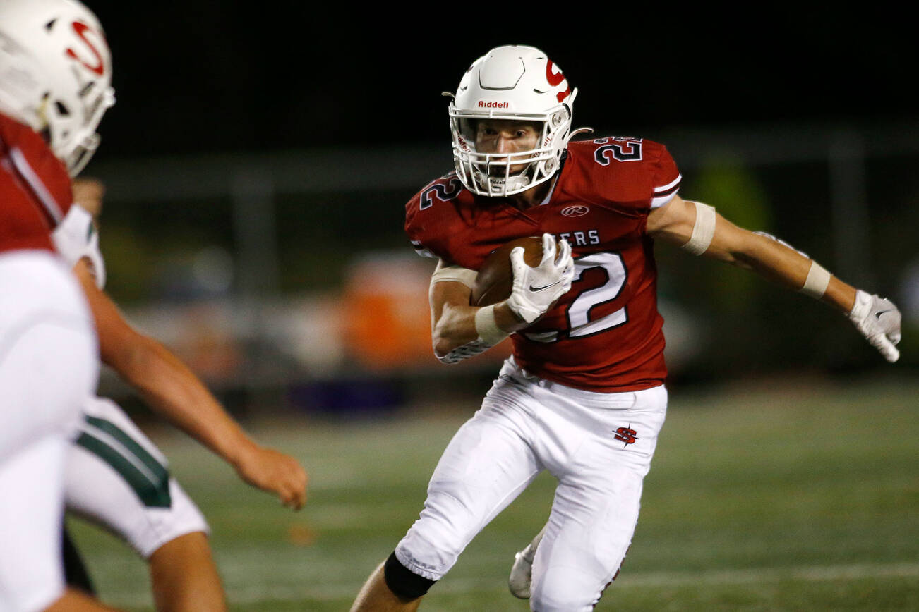 Snohomish’s Kyle Larson finds space up the middle on a run against Edmonds-Woodway on Friday, Sep. 23, 2022, at Snohomish High School in Snohomish, Washington. (Ryan Berry / The Herald)