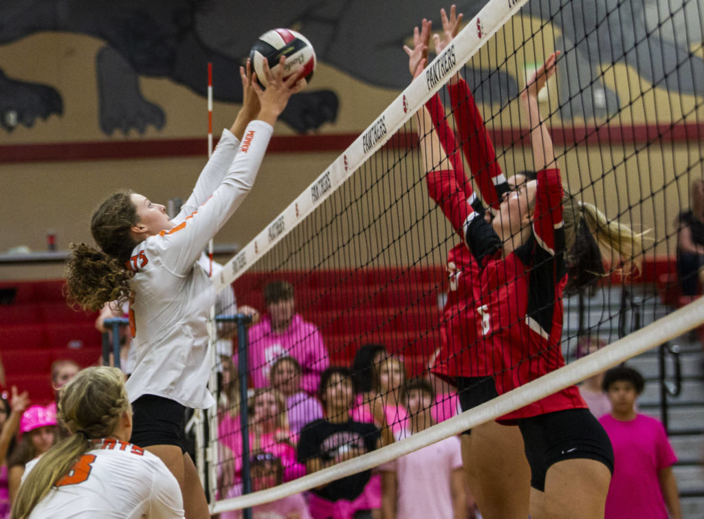 Monroe’s Jessi Mahler sets the ball over the net during the match against Snohomish on Tuesday, Sept. 27, 2022 in Snohomish, Washington. (Olivia Vanni / The Herald)