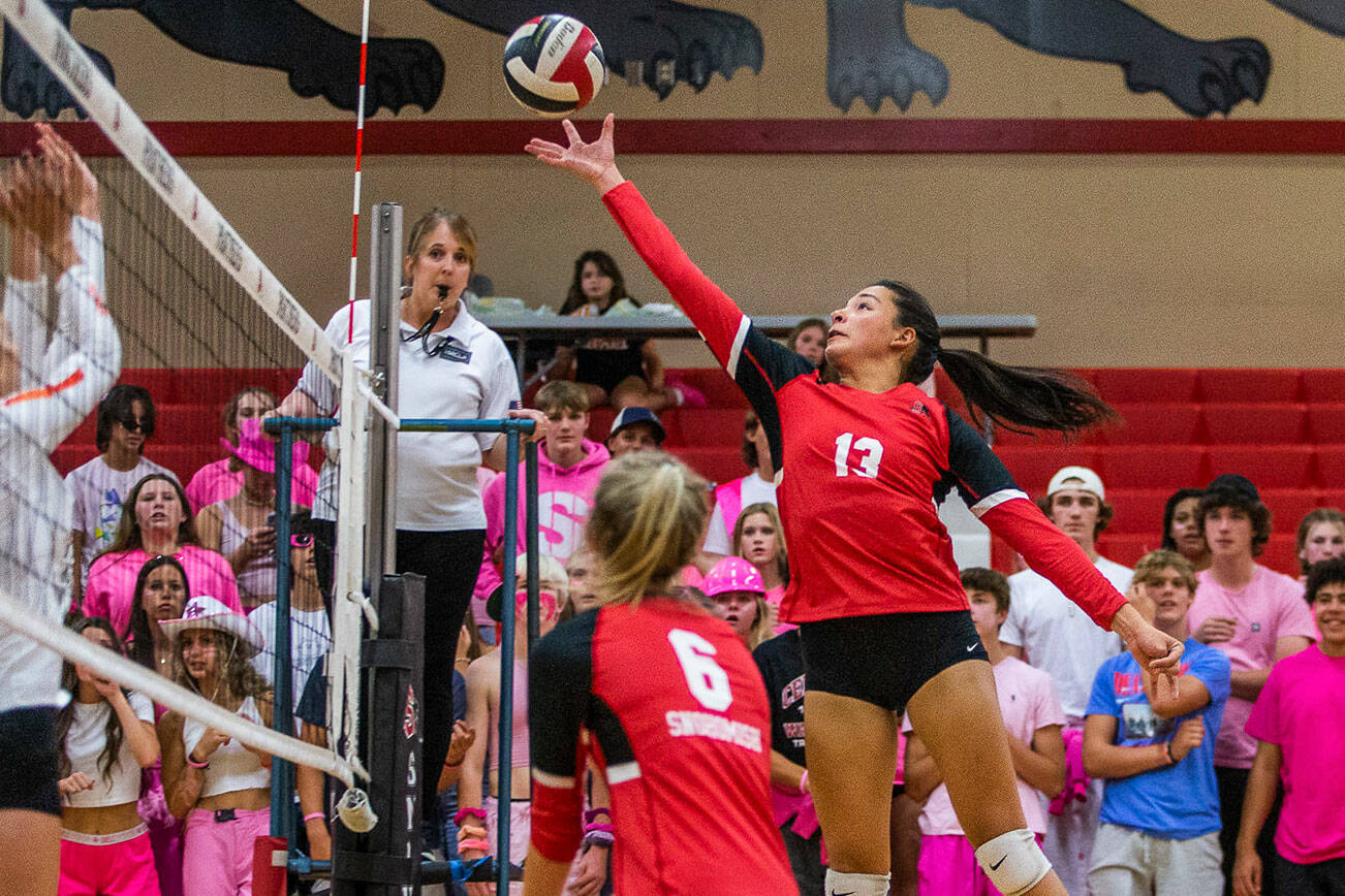 Snohomish’s Adriannah Galvan jumps to tip the ball over the net during the match against Monroe on Tuesday, Sept. 27, 2022 in Snohomish, Washington. (Olivia Vanni / The Herald)