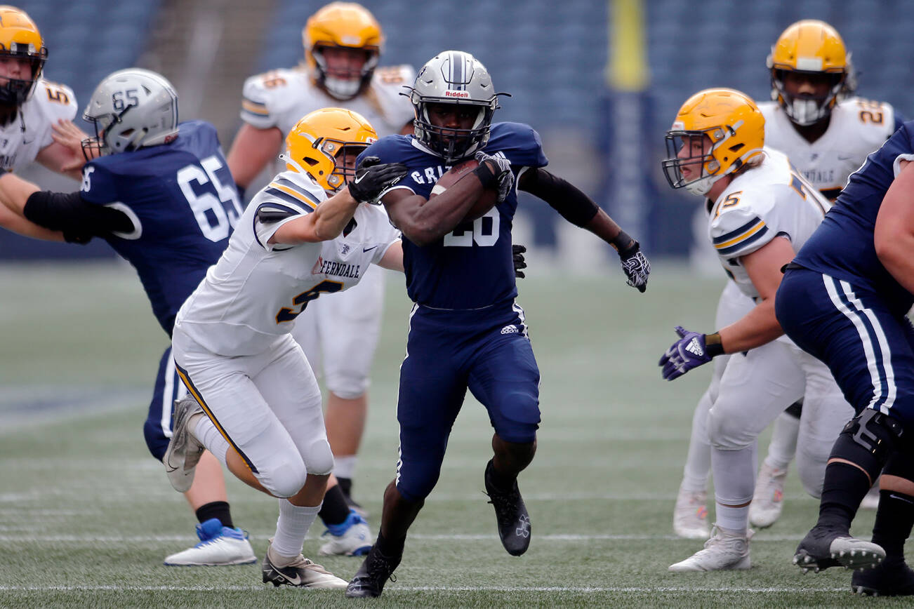 Glacier Peak’s Chrisvin Bonshe nearly takes a carry into the secondary before getting pulled down by the jersey against Ferndale on Saturday, Sep. 17, 2022, at Lumen Field in Seattle, Washington. (Ryan Berry / The Herald)