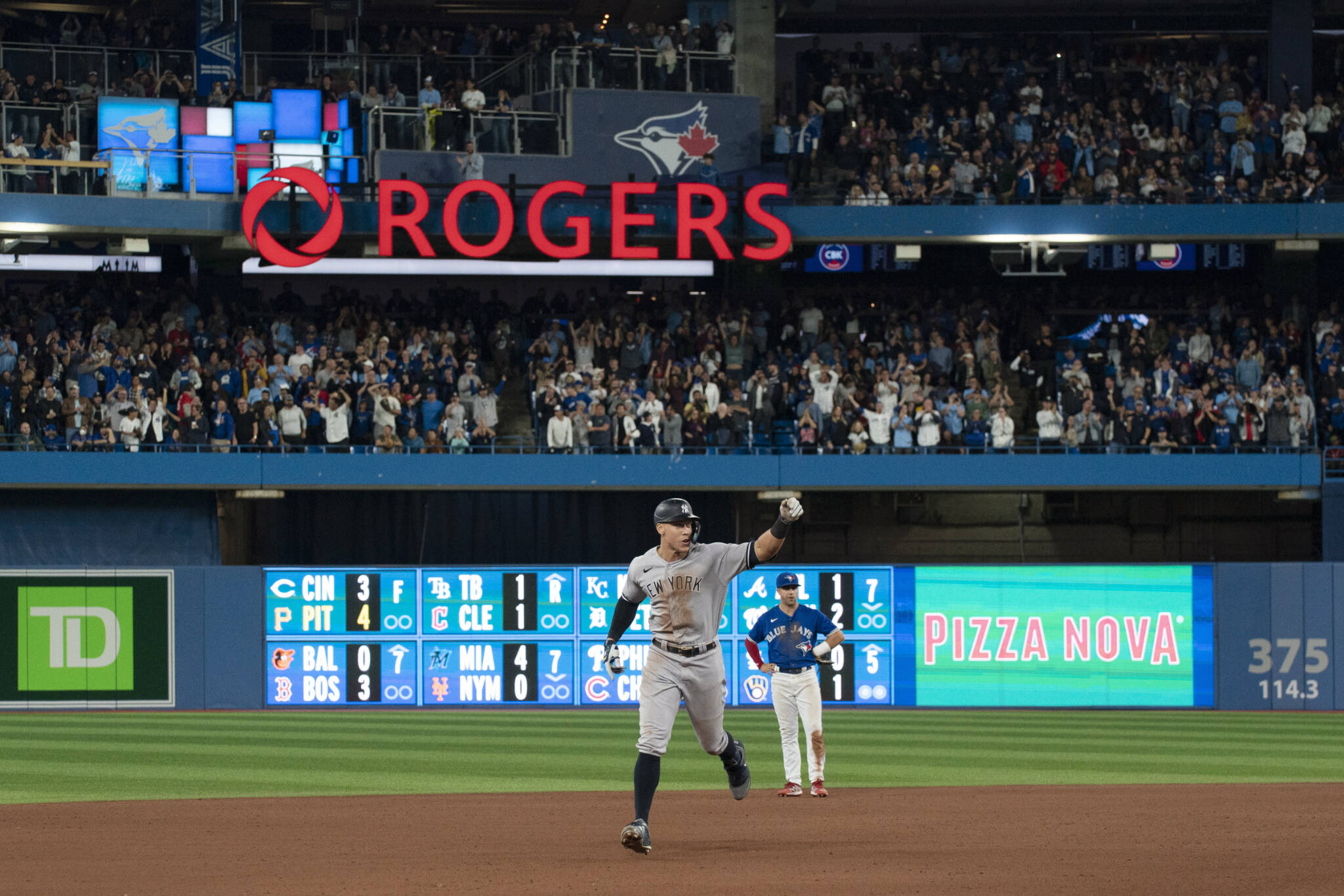 The Yankees’ Aaron Judge runs the bases after hitting his 61st home run of the season during the seventh inning of a game against the Blue Jays on Wednesday in Toronto. (Alex Lupul/The Canadian Press via AP)