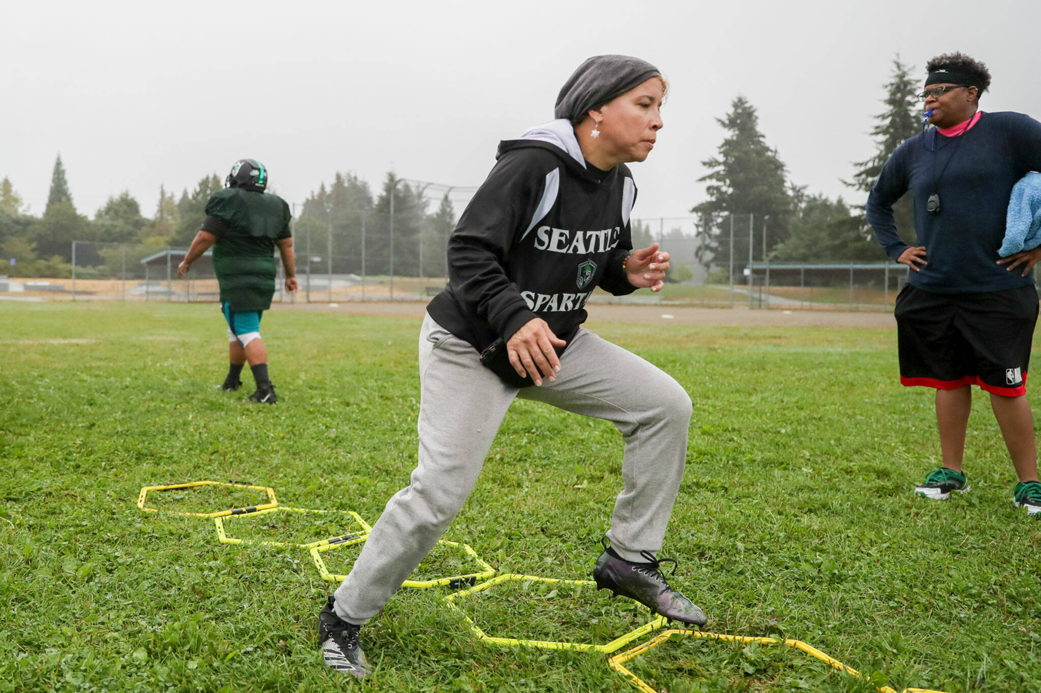 Nicole Pelham, owner and player, of the Seattle Spartans runs through drills during practice on Sept. 3, in Shoreline. (Kevin Clark / The Herald)