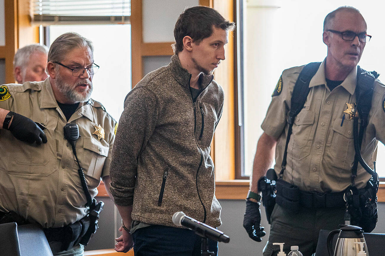 Cole Krause is handcuffed after being sentenced to 17 1/2 years in prison for four counts of felony sexual assault on Wednesday, Oct. 19, 2022 in Everett, Washington. (Olivia Vanni / The Herald)