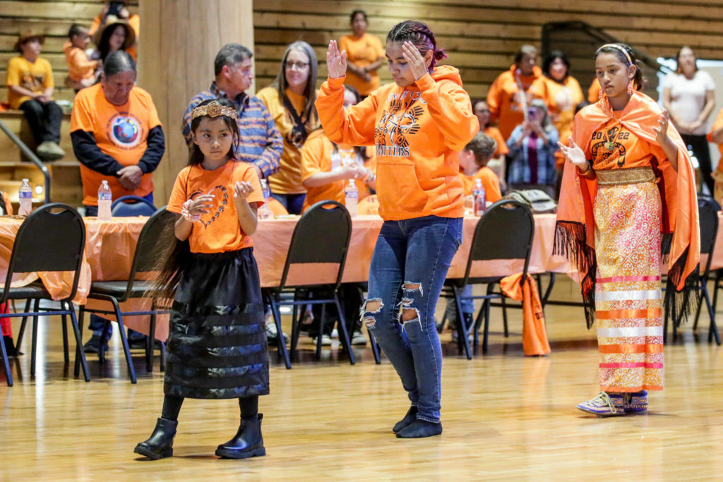 Tribal members dance to start an assemble on the National Day for Truth and Reconciliation and Orange Shirt Day Friday evening at Tulalip Gathering Hall on Sept. 30, in Tulalip. (Kevin Clark / The Herald)
