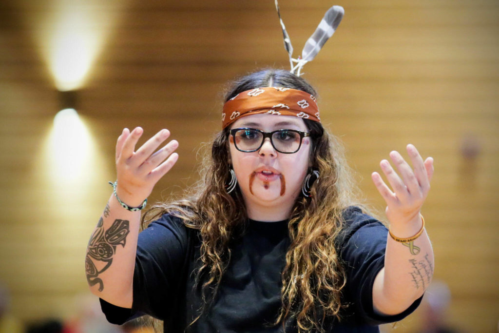 Tony Hatch dances to start an assemble on the National Day for Truth and Reconciliation and Orange Shirt Day Friday evening at Tulalip Gathering Hall on Sept. 30, in Tulalip. (Kevin Clark / The Herald)
