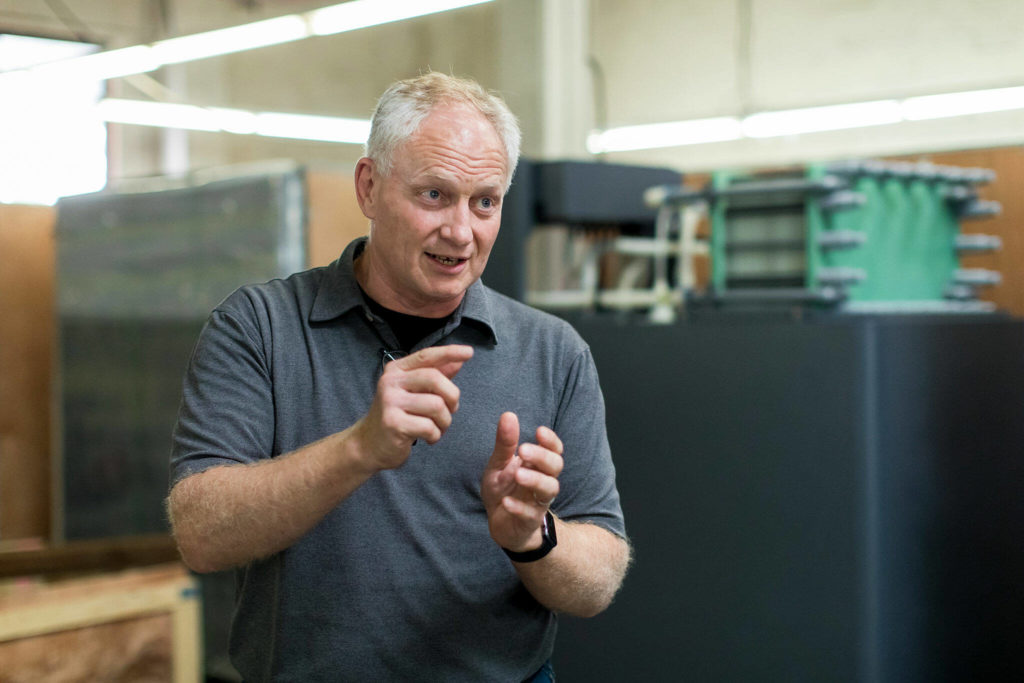 Rick Winter, a founder of the former UniEnergy Technologies, speaks with a reporter Aug. 10. (Dan DeLong / InvestigateWest)
