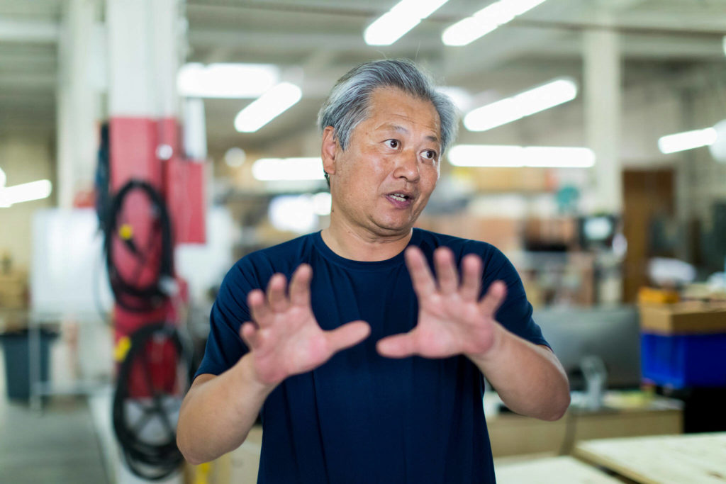 Gary Yang, a founder of the former UniEnergy Technologies, speaks with a reporter Aug. 10. (Dan DeLong / InvestigateWest)
