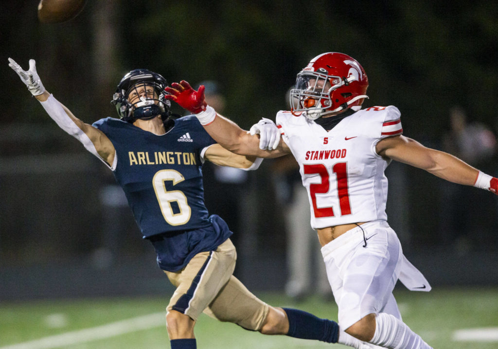 Arlington’s Kaleb Adams reaches out for a pass during the Stilly Cup against Stanwood on Friday, Sept. 30, 2022 in Arlington, Washington. (Olivia Vanni / The Herald)
