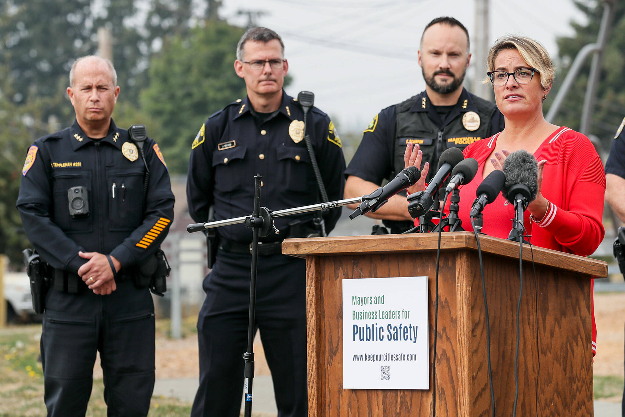 Cassie Franklin, right, mayor of Everett, introduces a coalition to address public safety concerns Tuesday afternoon at Henry M. Jackson Park, in Everett. (Kevin Clark / The Herald)