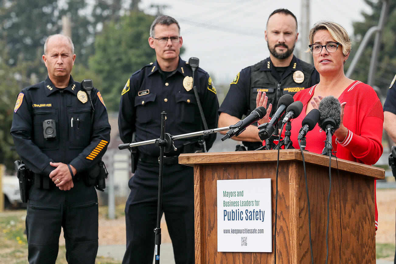 Cassie Franklin, right, mayor of Everett, introduces a coalition to address public safety concerns Tuesday afternoon at Henry M. Jackson Park in Everett, Washington on October 4, 2022.  (Kevin Clark / The Herald)