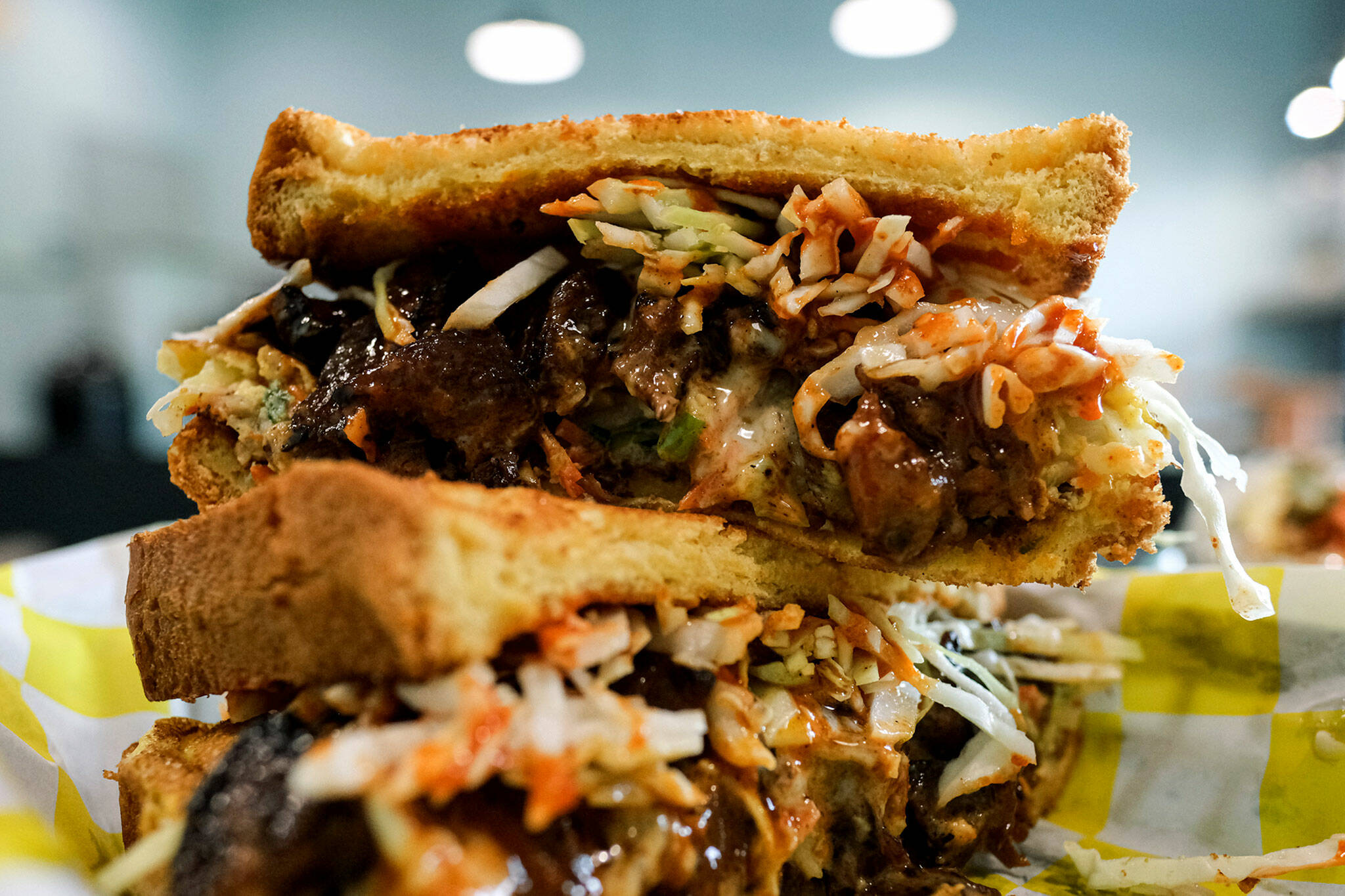 The steak toast at Bapmukja in Lynnwood is stacked with marinated short rib, Korean chili pepper sauce, melted cheese and cabbage. (Taylor Goebel / The Herald)