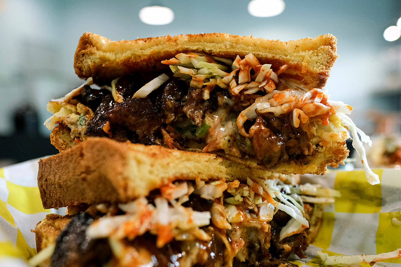 The steak toast at Bapmukja in Lynnwood is stacked with marinated short rib, Korean chili pepper sauce, melted cheese and cabbage. Friday, Oct. 7, 2022. (Taylor Goebel / The Herald)