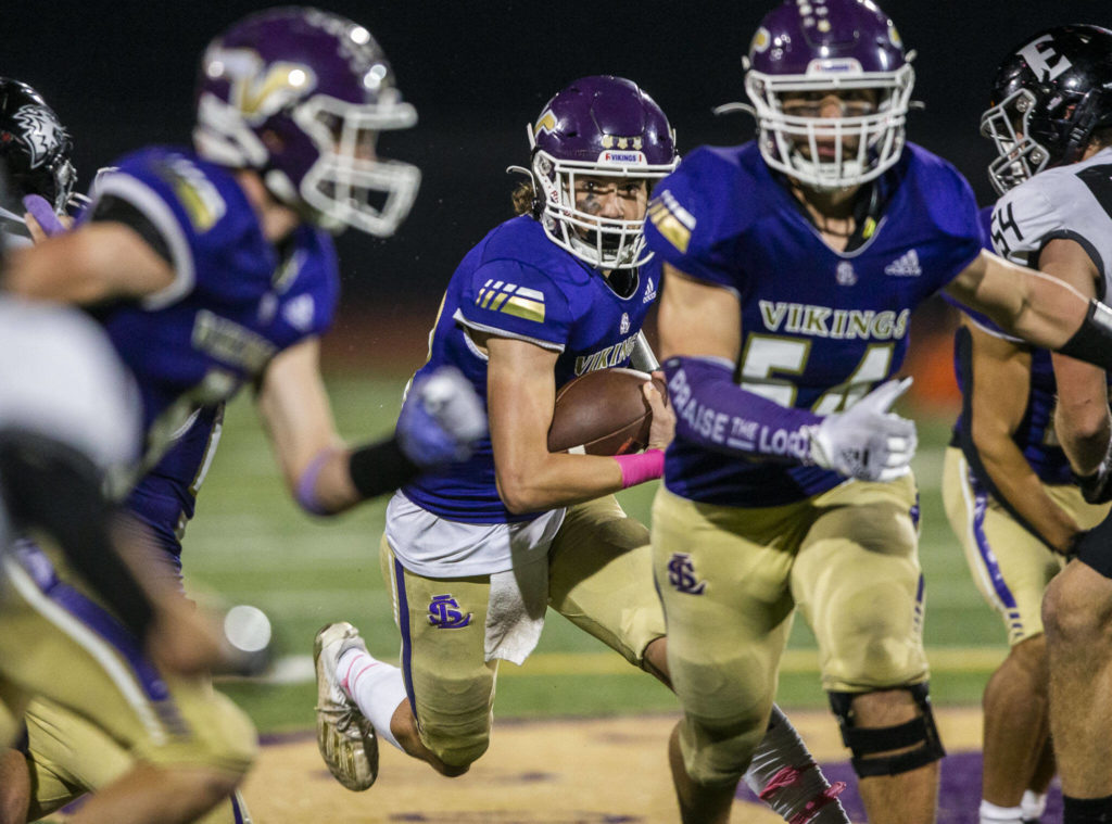 Lake Stevens’ Kolton Mason runs the ball during the game against Eastlake on Friday, Oct. 7, 2022 in Lake Stevens, Washington. (Olivia Vanni / The Herald)

