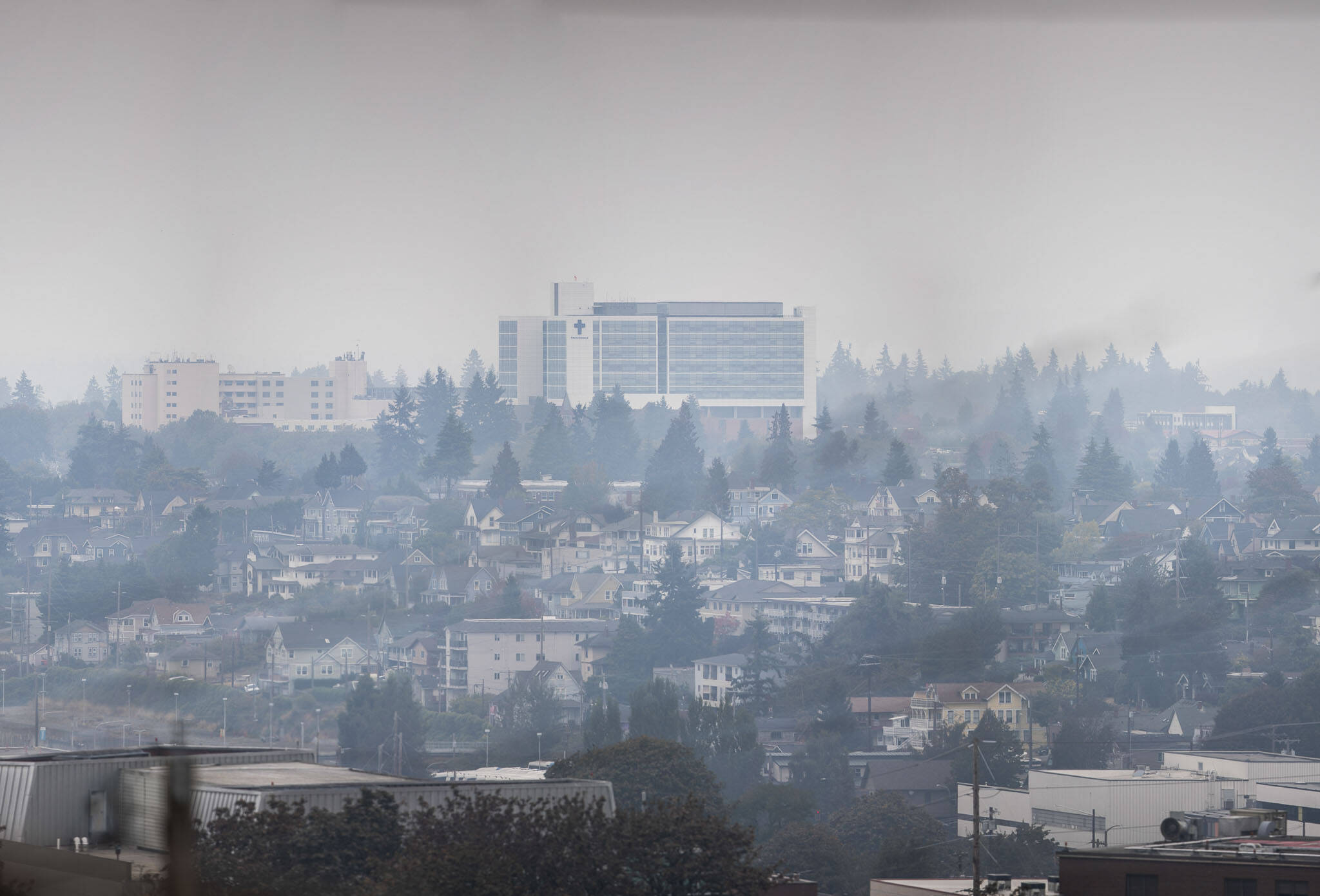Smoke settles in over Everett on Monday, in Everett. (Olivia Vanni / The Herald)