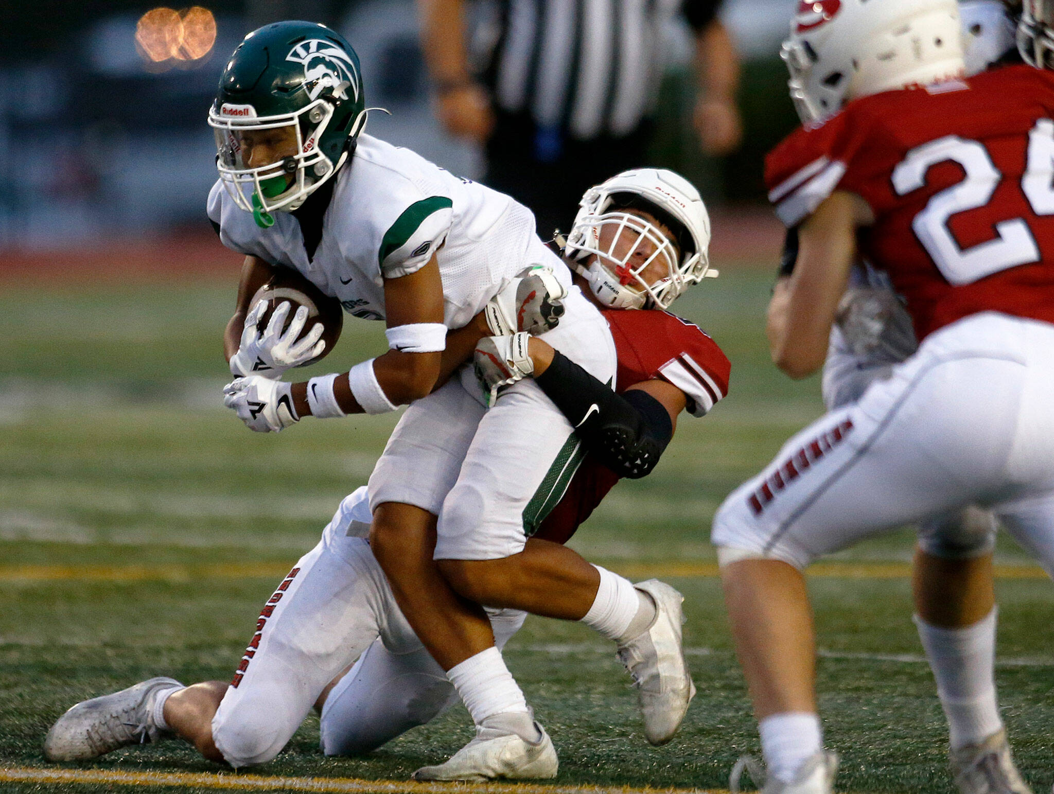 Edmonds-Woodway’s Jesse Hart III carries the ball against Snohomish on Sept. 23 at Snohomish High School. (Ryan Berry / The Herald)