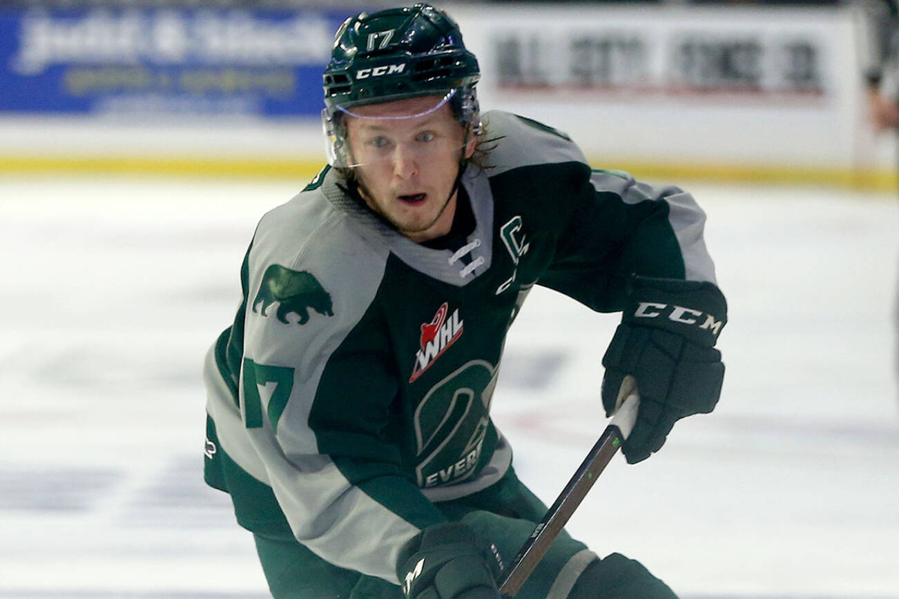 Everett Silvertips’ Jackson Berezowski turns with the puck in the offensive zone during the season opener against the Vancouver Giants on Saturday, Sep. 24, 2022, at Angel of the Winds Arena in Everett, Washington. (Ryan Berry / The Herald)