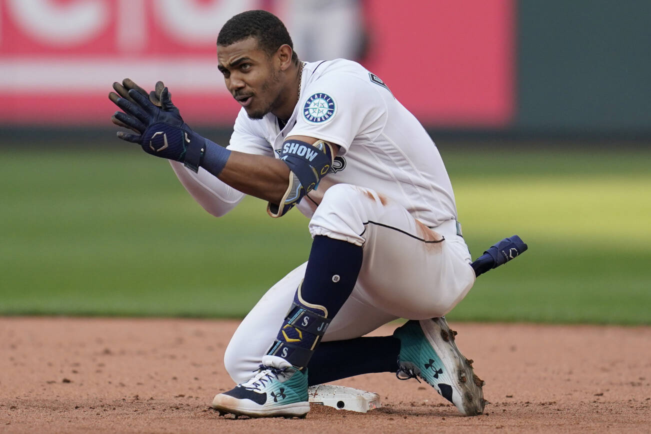 Seattle Mariners' Julio Rodriguez celebrates after hitting a double against the Houston Astros during the eighth inning in Game 3 of an American League Division Series baseball game Saturday, Oct. 15, 2022, in Seattle. (AP Photo/Abbie Parr)