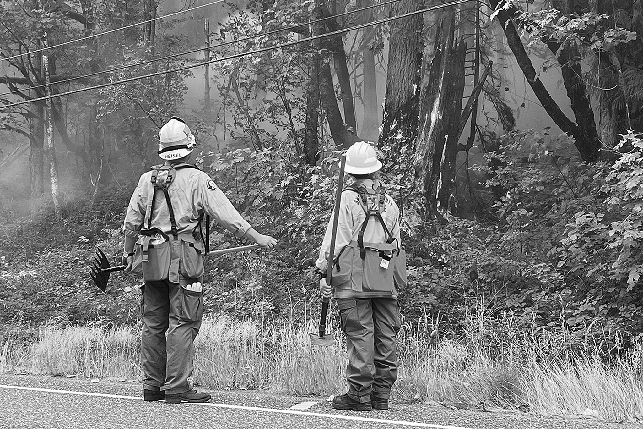 Peter Mongillo / Snohomish County Regional Fire and Rescue
Firefighters continue efforts against the Bolt Creek wildfire in mid-September near U.S. 2. As wildfires grow in frequency and acreage in Western Washington, the changes they bring to forestlands need further study.