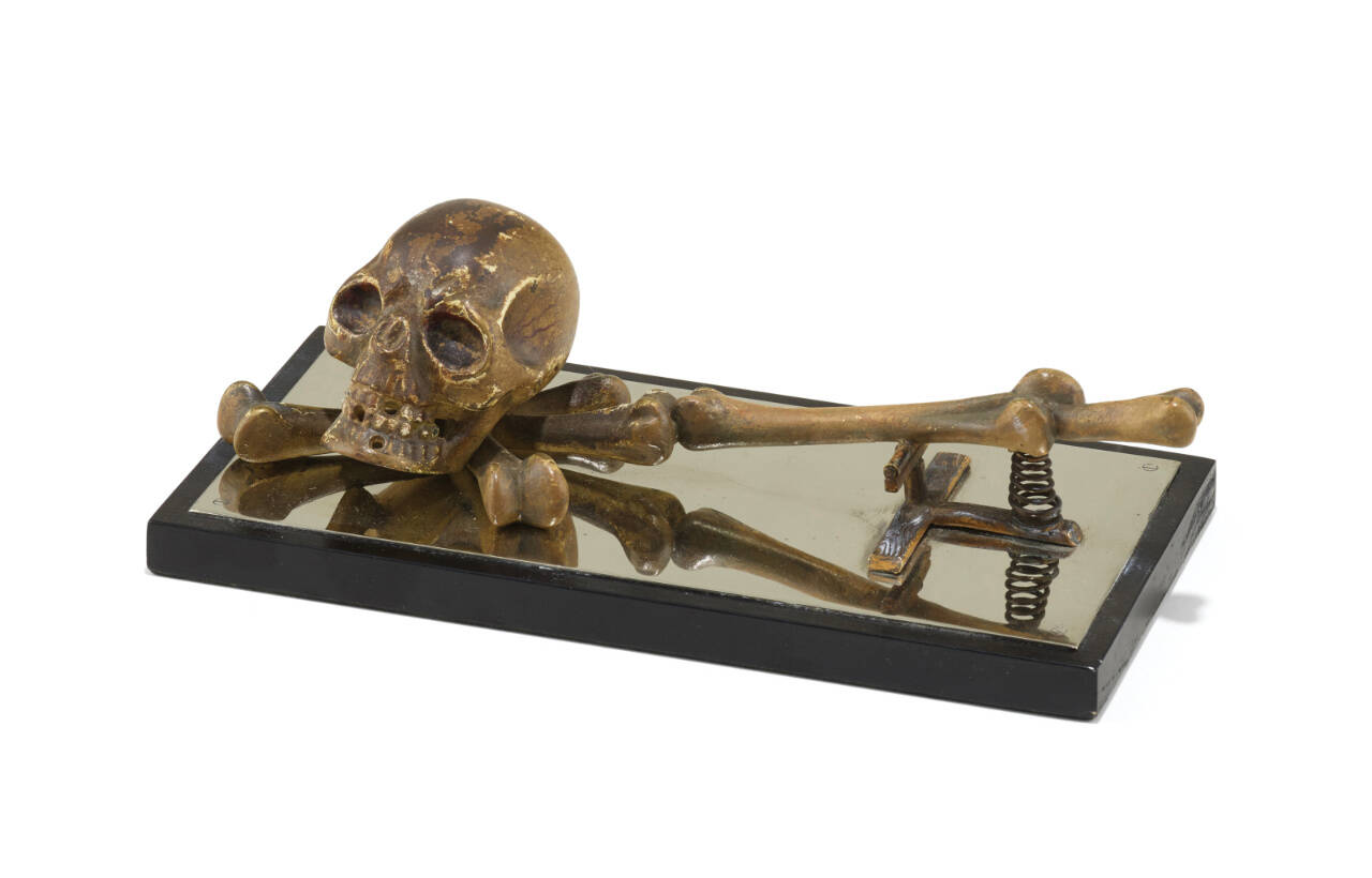 This paper clip features a bronze skull and bones, making it ready for Halloween any time of the year. Is it a modern-day memento mori or a sly comment on the tedium of paperwork?