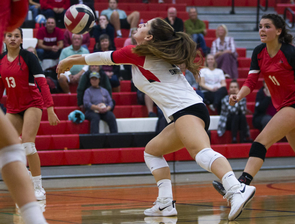 Snohomish’s Anika Smith digs the ball during the match against Snohomish on Wednesday, Oct. 19, 2022 in Snohomish, Washington. (Olivia Vanni / The Herald)
