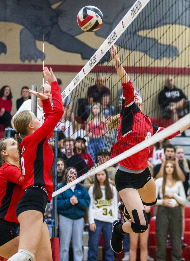 Snohomish’s Reagan Bullock tips the ball over the net during the match against Archbishop Murphy on Wednesday, Oct. 19, 2022 in Snohomish, Washington. (Olivia Vanni / The Herald)
