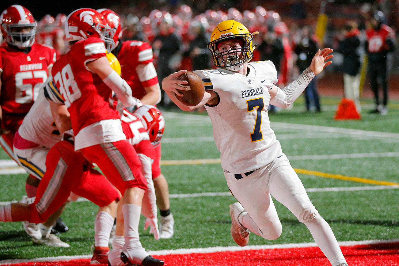 Ferndale’s Zach Nielson celebrates after scoring a first quarter touchdown against Stanwood Friday, Oct. 21, 2022, at Stanwood High School in Stanwood, Washington. (Ryan Berry / The Herald)