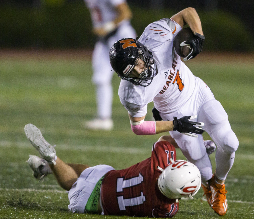Monroe’s Kody Edelbrock runs the ball during a game against Snohomish on Friday, Oct. 21, 2022 in Snohomish, Washington. (Olivia Vanni / The Herald)
