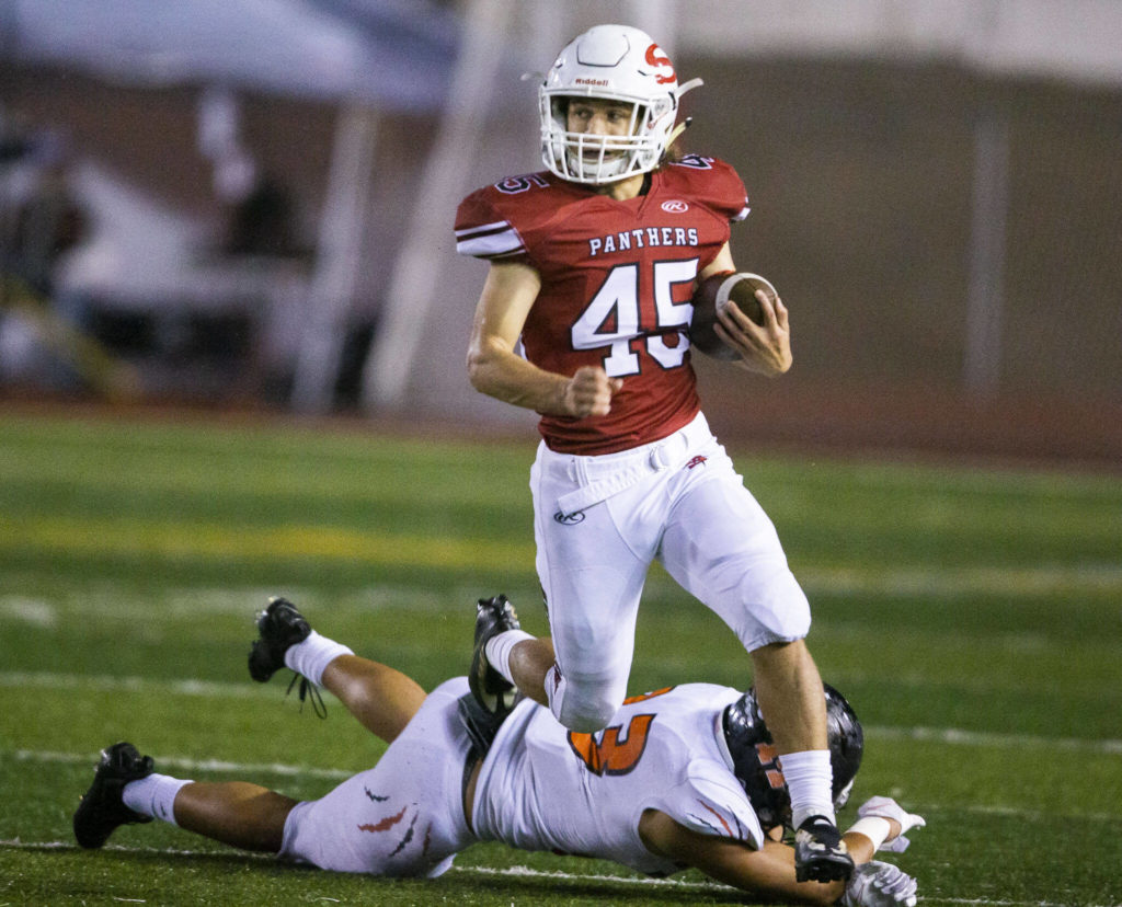 Snohomish’s Caleb Podoll runs the ball during a game against Monroe on Friday, Oct. 21, 2022 in Snohomish, Washington. (Olivia Vanni / The Herald)
