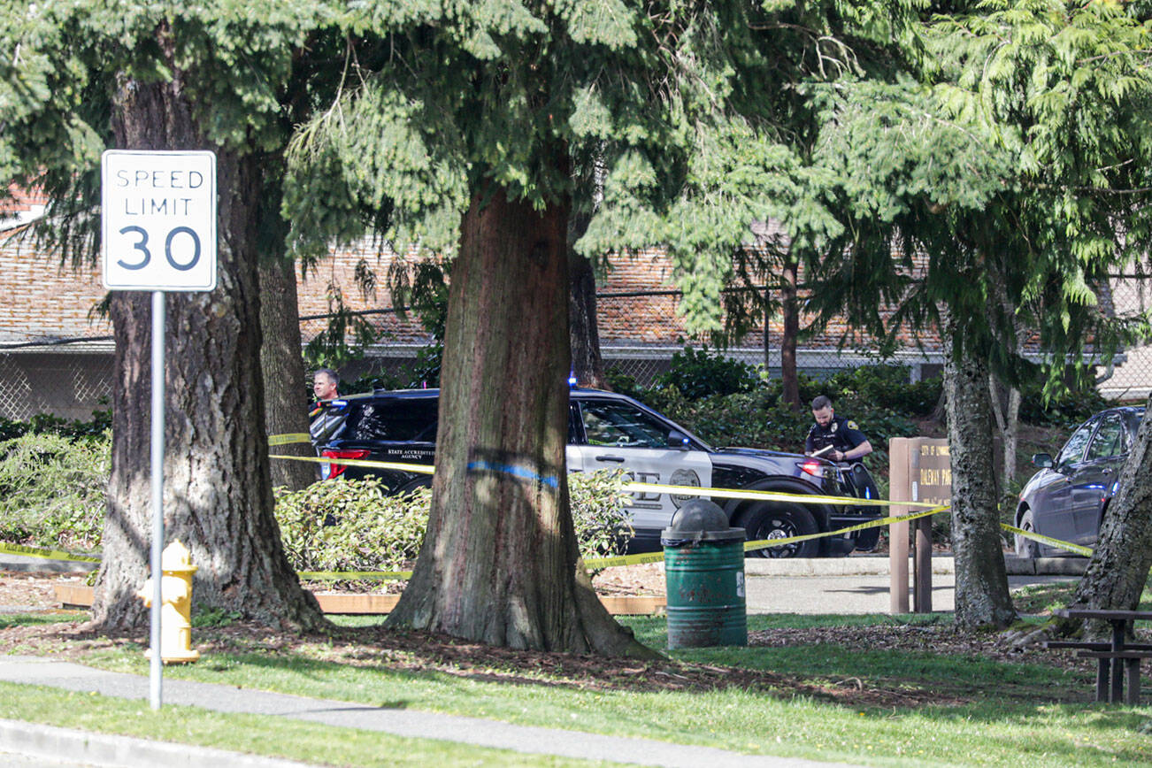 Police officials investigate a shooting at Daleway Park Tuesday afternoon in Lynnwood on April 5, 2022.   (Kevin Clark / The Herald)