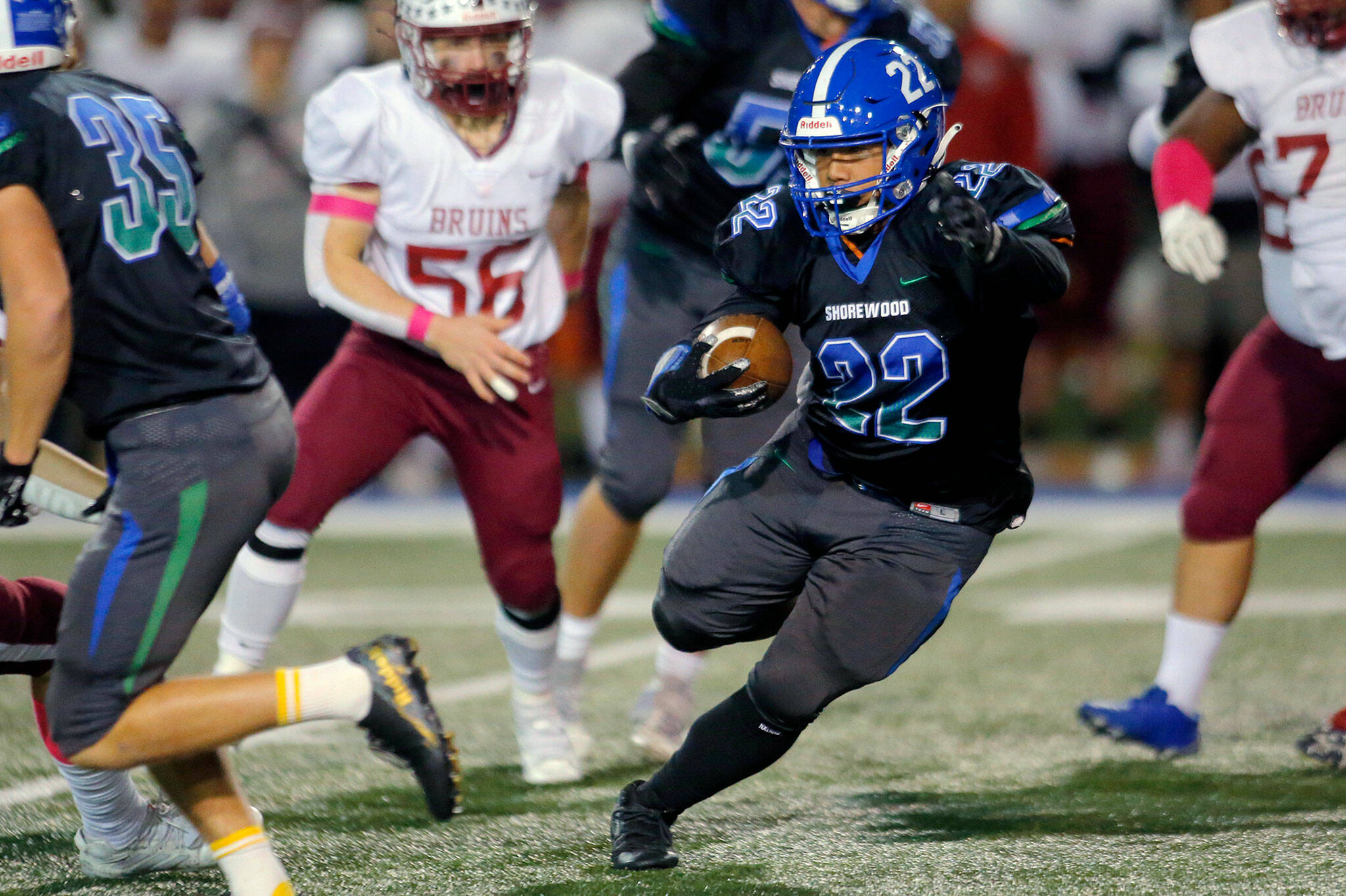 Shorewood senior running back Eduardo Eulogio changes direction after taking a handoff in the first half of a game against Cascade on Wednesday, Oct. 26, 2022, at Shoreline Stadium in Shoreline, Washington. (Ryan Berry / The Herald)