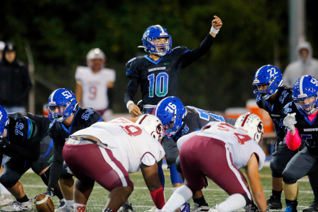 Shorewood’s Rory Swanson calls out to a wide receiver before a play against Cascade on Wednesday, Oct. 26, 2022, at Shoreline Stadium in Shoreline, Washington. (Ryan Berry / The Herald)
