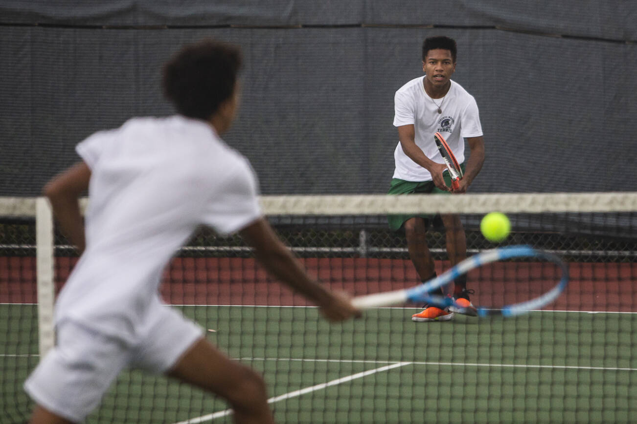 Edmonds-Woodway Russell Anderson, right, waits for the next volley from bother Steven Anderson during the 3A district singles championship match on Thursday, Oct. 27, 2022 in Snohomish, Washington. (Olivia Vanni / The Herald)