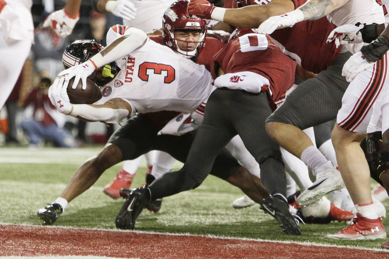 Utah running back Ja'Quinden Jackson (3) reaches for a touchdown during the first half of an NCAA college football game against Washington State, Thursday, Oct. 27, 2022, in Pullman, Wash. (AP Photo/Young Kwak)