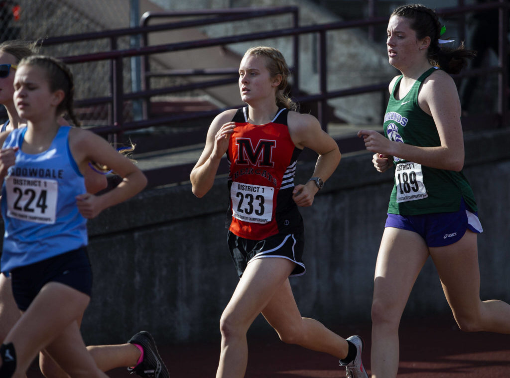 Monroe’s Alexis Canovali-McKenzie runs the the leading group of runners during the 3A Girls District Cross Country championship race on Saturday, Oct. 29, 2022 in Arlington, Washington. (Olivia Vanni / The Herald)
