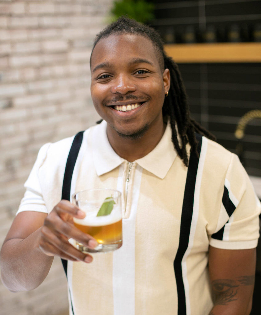 Nigel Lindsey, of Revolution by the Barrel, toasts with a New York sour he threw together on Nov. 6, at Think Tank Cowork in Everett. (Ryan Berry / The Herald) 
