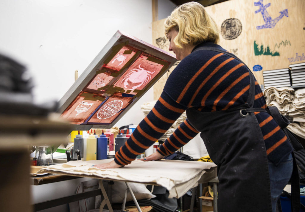 Janae Cameron preps her table to make a screen print. (Olivia Vanni / The Herald)
