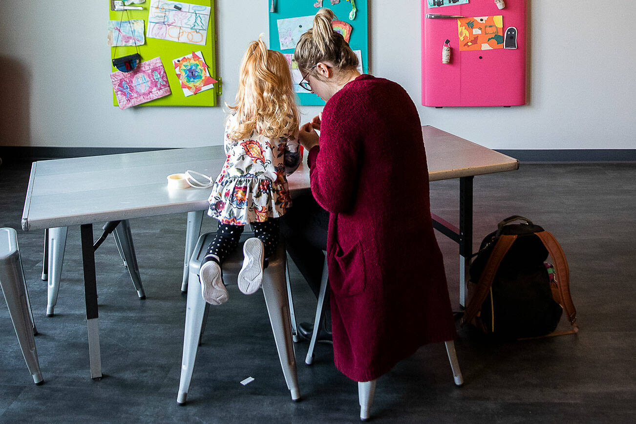 Jollee Nichols, right, and daughter Ruby, 2, work on an art project together at the Imagine Children’s Museum on Wednesday, Oct. 26, 2022 in Everett, Washington. (Olivia Vanni / The Herald)