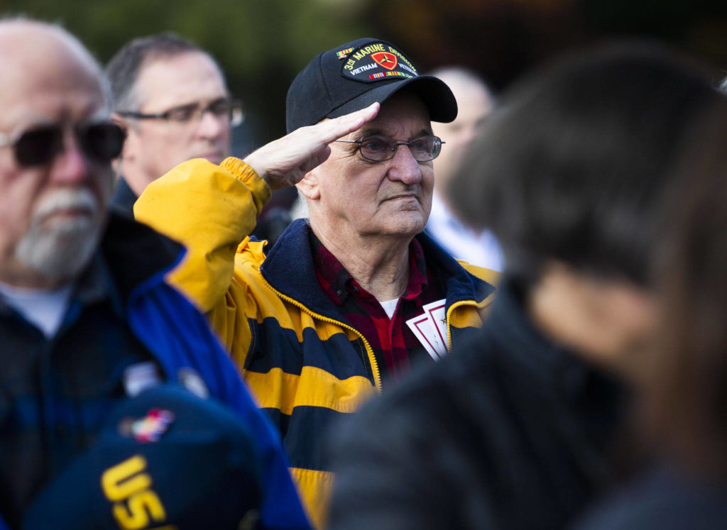 A Vietnam Veteran salutes during the presentation of colors at the dedication ceremony for the new Gold Star Families Memorial Monument on Wednesday, in Lynnwood. (Olivia Vanni / The Herald)
