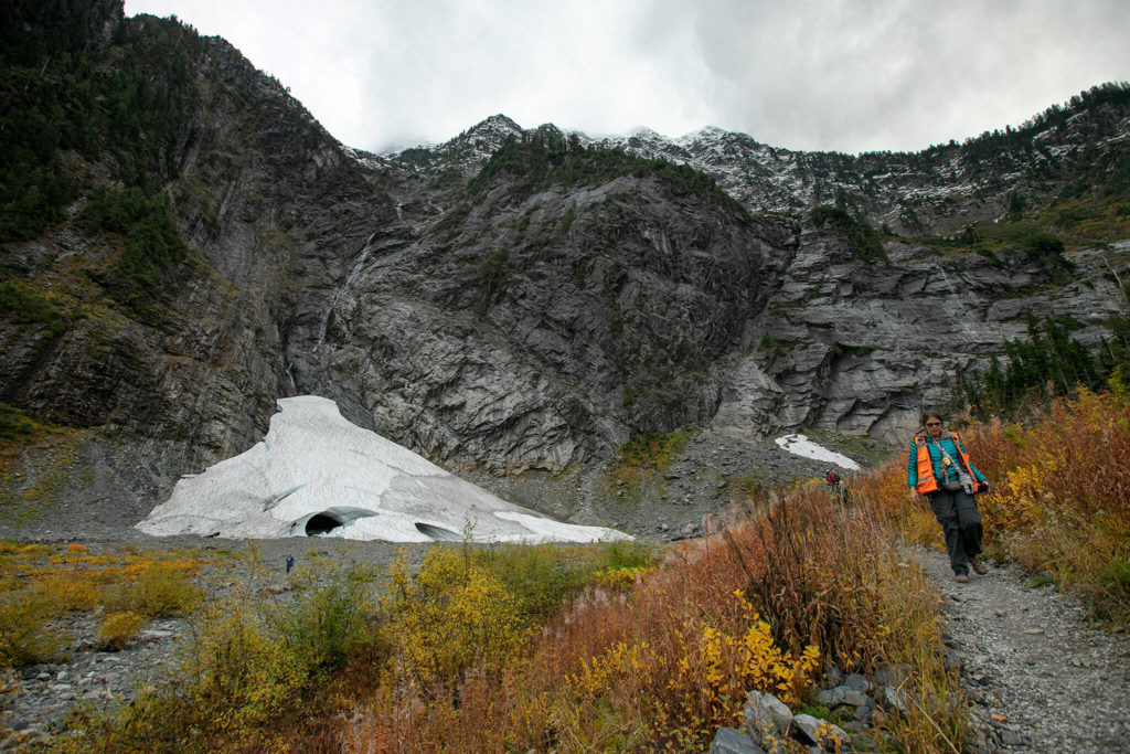 A hiker begins the journey back from Big Four Ice Caves on Oct. 28, in Mount Baker-Snoqualmie National Forest near Granite Falls. (Ryan Berry / The Herald)
