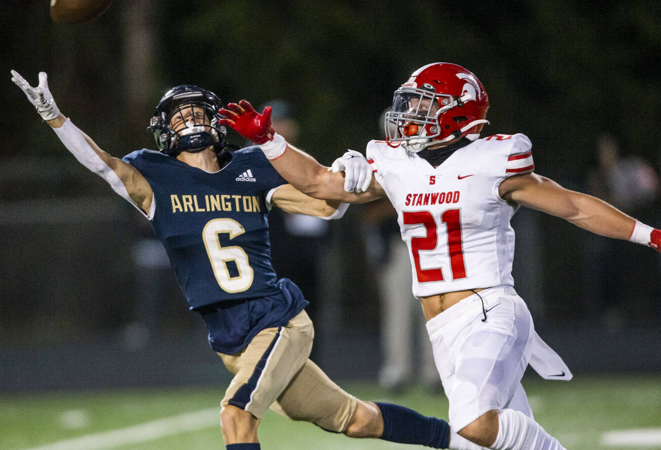 Arlington’s Kaleb Adams reaches out for a pass during the Stilly Cup against Stanwood on Friday, Sept. 30, 2022 in Arlington, Washington. (Olivia Vanni / The Herald)
