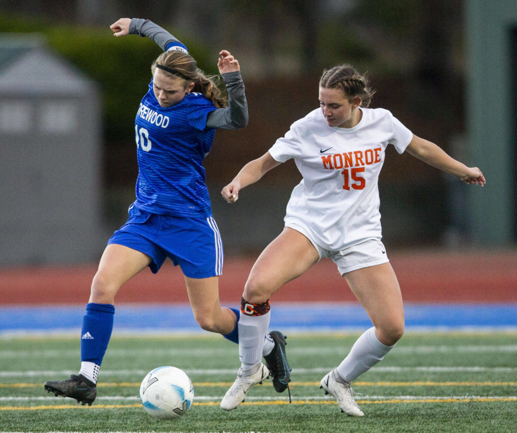 Monroe’s Megan Hurley pushes Shorewood’s Madalyn Swartz off of the ball during game on Tuesday, Nov. 1, 2022 in Shoreline, Washington. (Olivia Vanni / The Herald)
