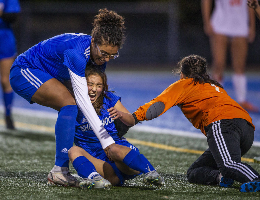 Shorewood Cary Tanaka yells as she hit in the side by Monroe’s Brooke Boroughs after the two collided and Tanaka scored during game on Tuesday, Nov. 1, 2022 in Shoreline, Washington. (Olivia Vanni / The Herald)
